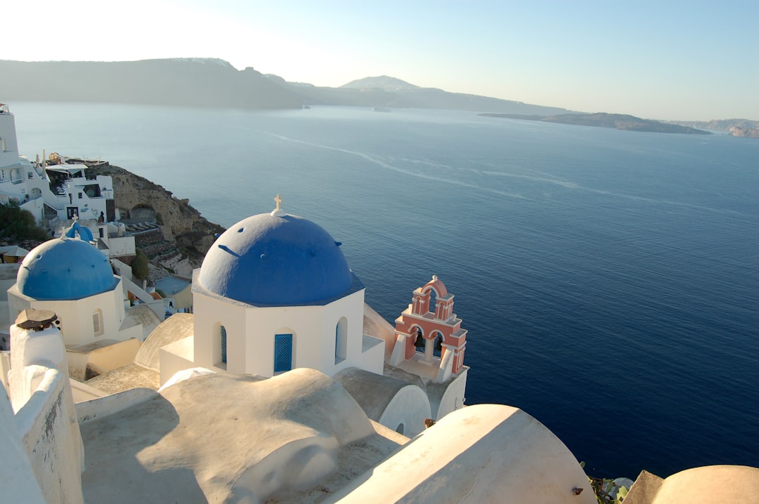 Santorini Greece white buildings and blue domes at sunset